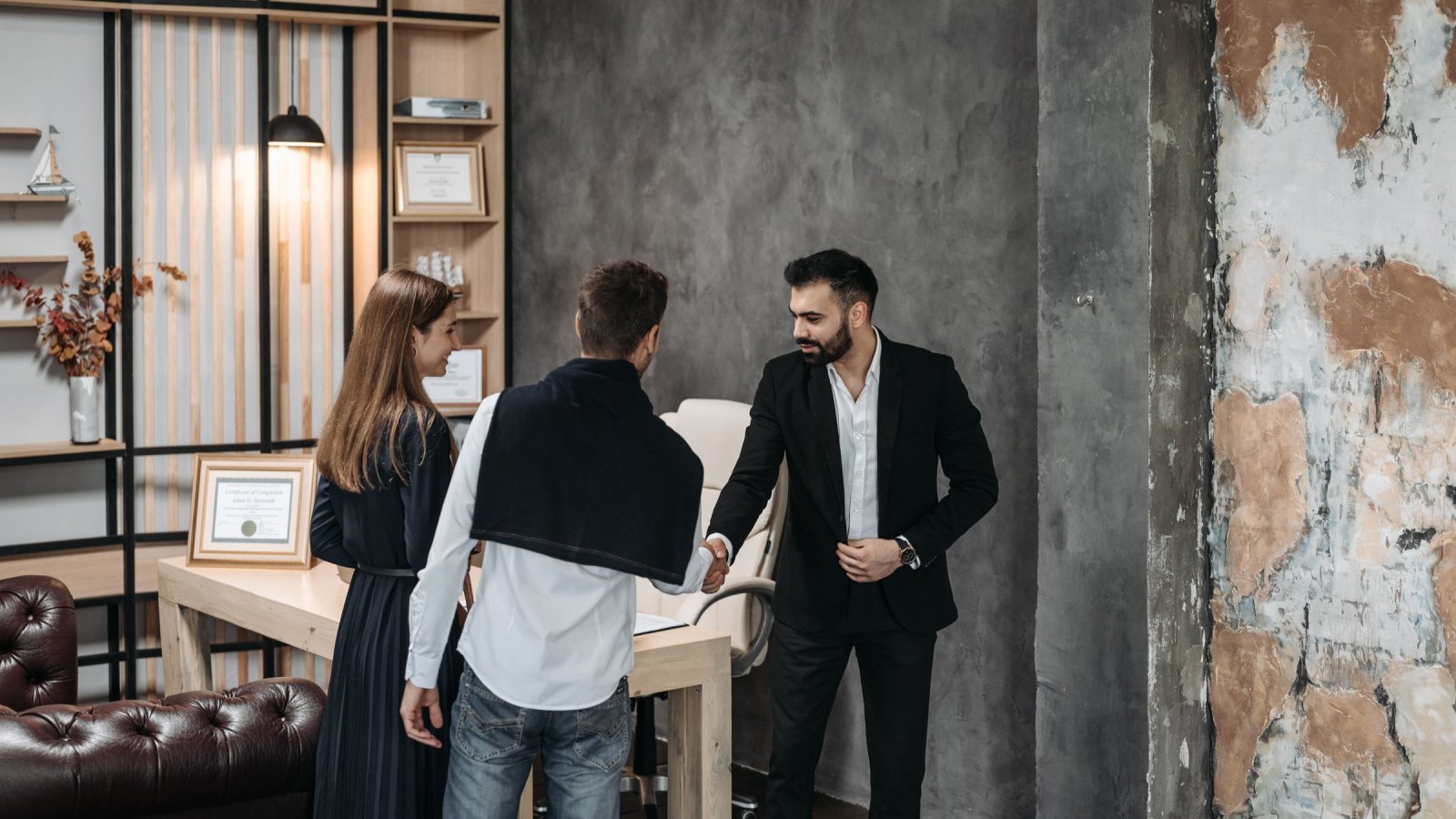 Partners shaking hands in an office